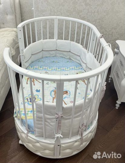 Детская овальная кроватка с маятником
