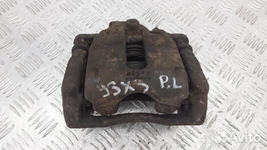 Суппорт тормозной передний левый nissan note E11