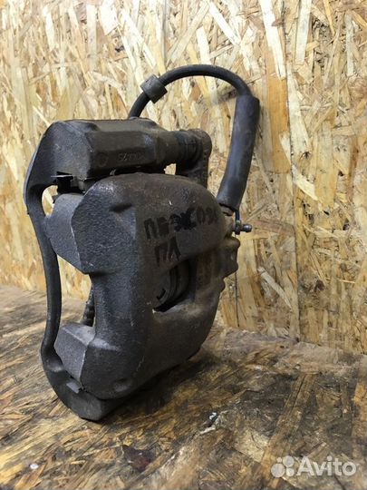 Суппорт тормозной передний левый Peugeot 308