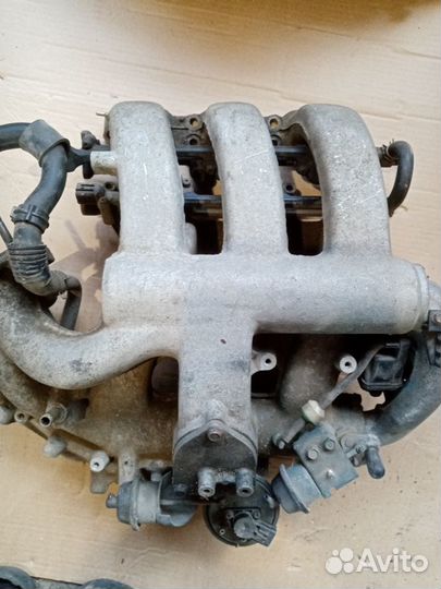 Коллектор впускной Mazda 323F 626