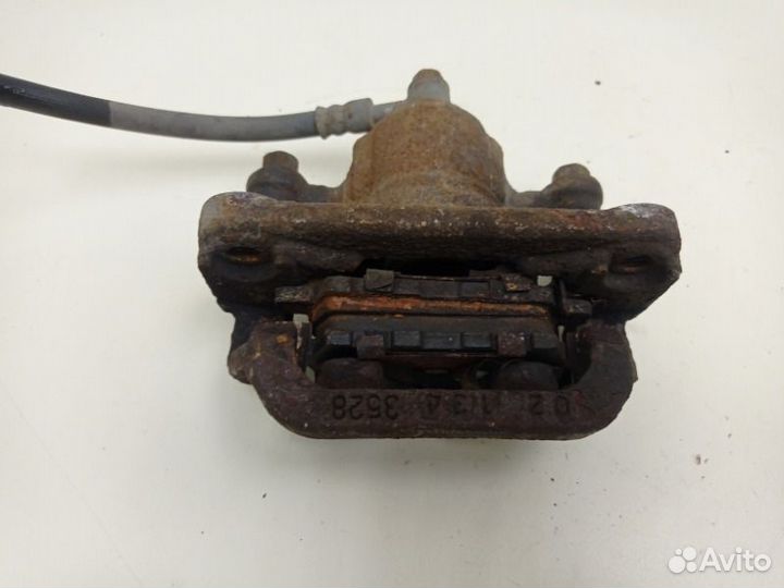 Суппорт тормозной задний правый Nissan Tiida