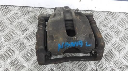 Суппорт тормозной передний левый nissan note E11