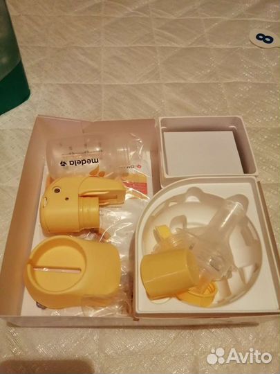 Молокоотсос medela электрический