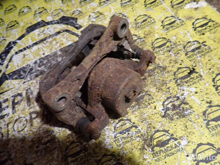 Суппорт тормозной передний левый Nissan Teana J31