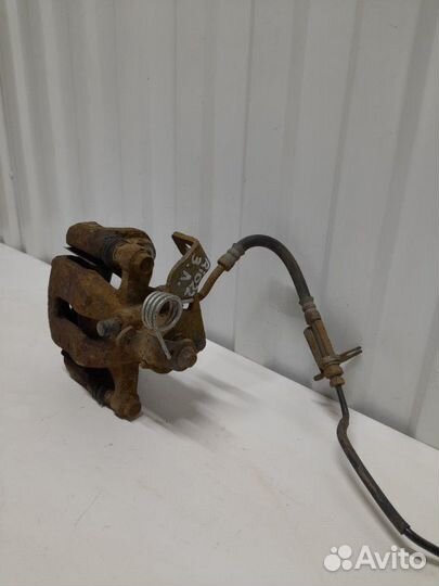 Суппорт тормозной задний левый Kia Rio QB 1.6 G4FC