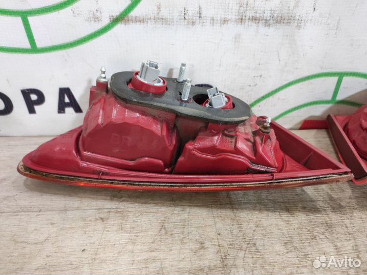 Фонарь в крышку багажника задний Mitsubishi Lancer