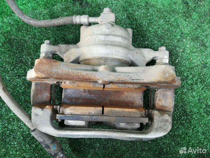 Суппорт тормозной передний правый Chevrolet Tracke