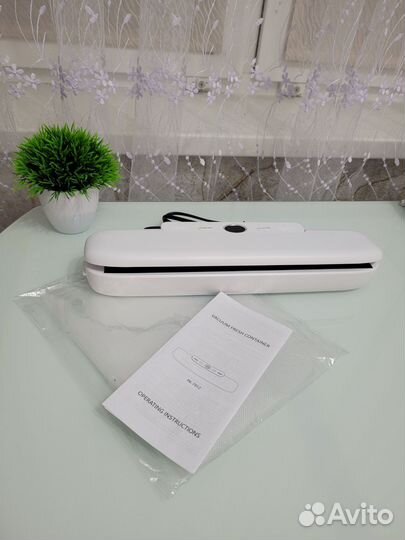 Вакуумный упаковщик новый