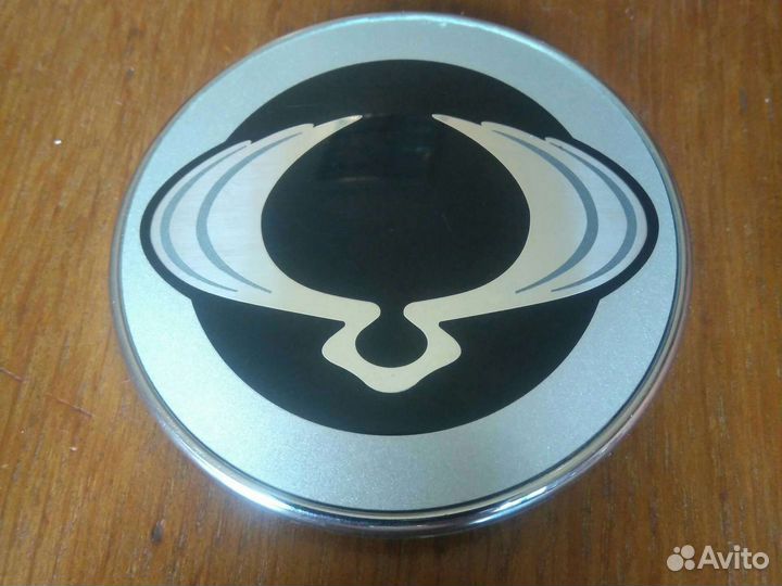 Шильдик -эмблема на Сан Йонг