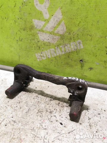 Скоба суппорта заднего Митсубиси Лансер 10