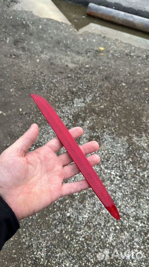 Отражатель заднего бампера левый