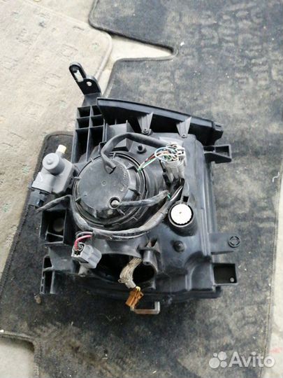 Фара передняя левая Nissan Cube Z11