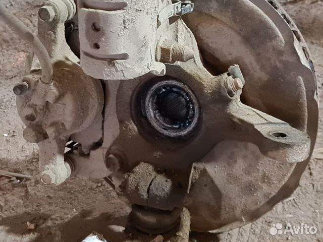 Кулак передний правый Mitsubishi lancer 10