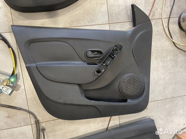 Обшивка двери передняя левая Renault Logan Stepway