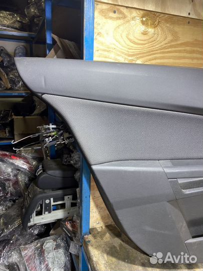 Обшивка задней левой двери Opel Astra H 79089