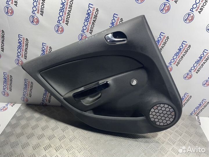 Обшивка двери Opel Corsa