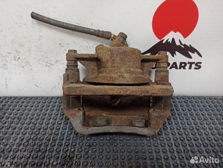 Суппорт тормозной передний левый Toyota Caldina