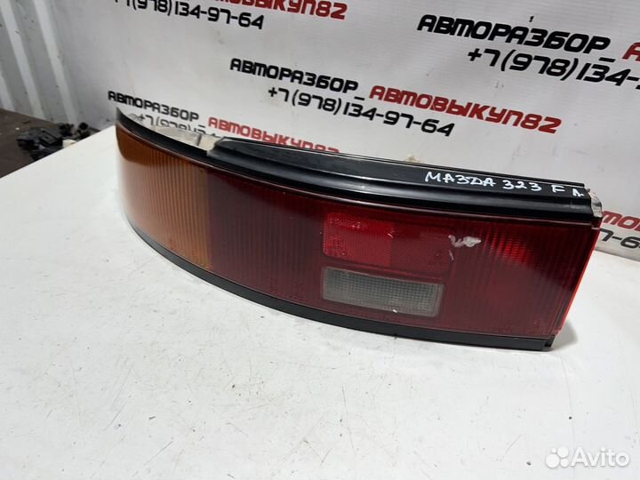Фонарь задний левый Mazda 323f bg