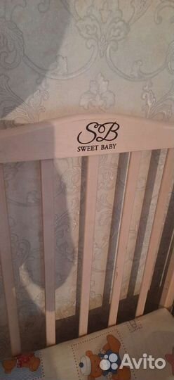 Детская кроватка с продольным маятником
