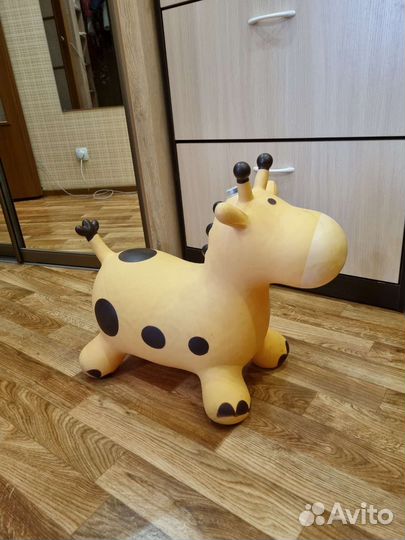 Игрушка прыгалка музыкальная Корова Жираф