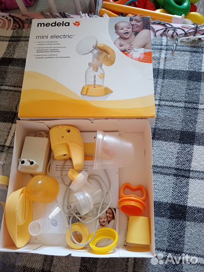 Молокоотсос medela электрический