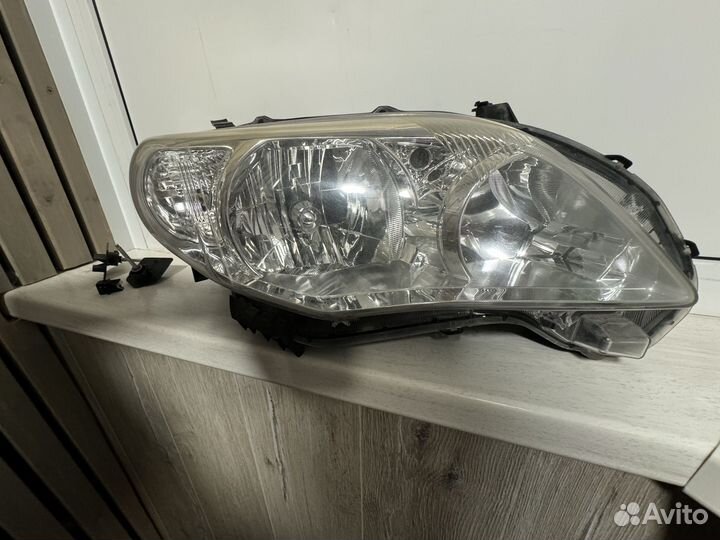 Фара левая для toyota corolla 150