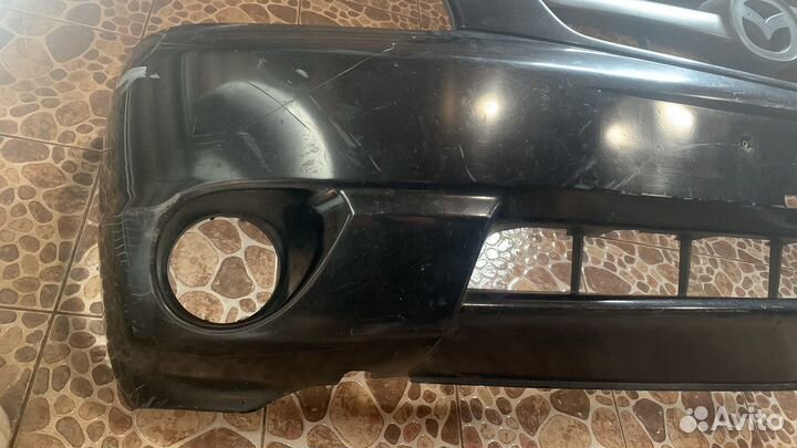 Передний бампер мазда трибют