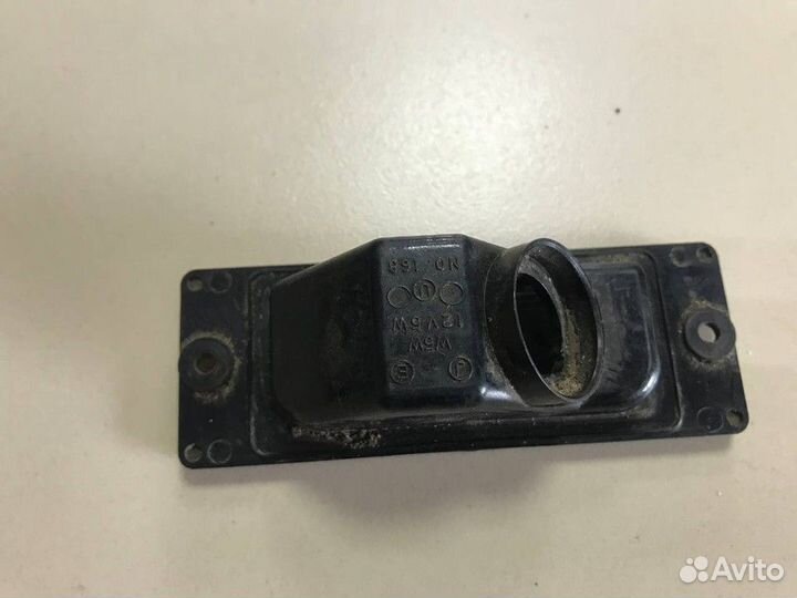 Фонарь подсветки номера Mitsubishi Pajero