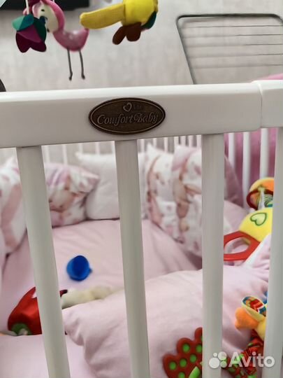 Детская кроватка с маятником