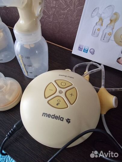 Молокоотсос medela электрический