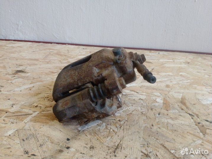 Суппорт тормозной передний левый Chevrolet Lanos