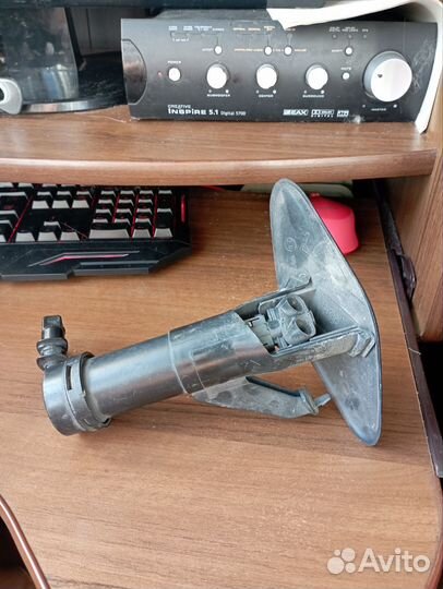 Форсунка омывателя фар левая Nissan Tiida