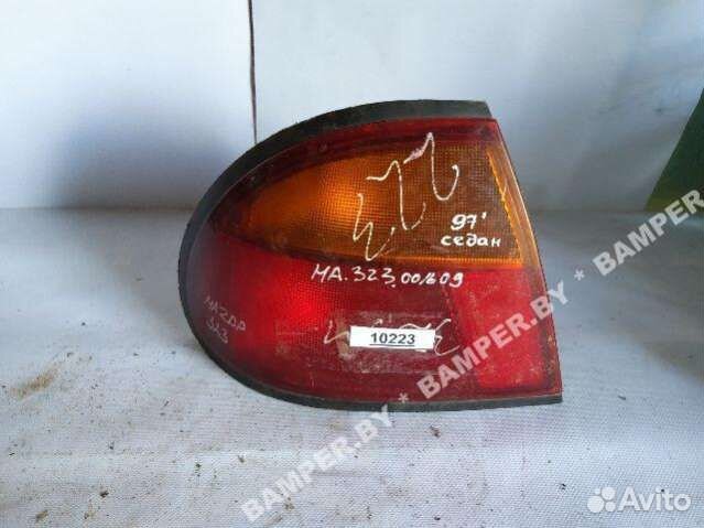 Фонарь задний левый Mazda 323