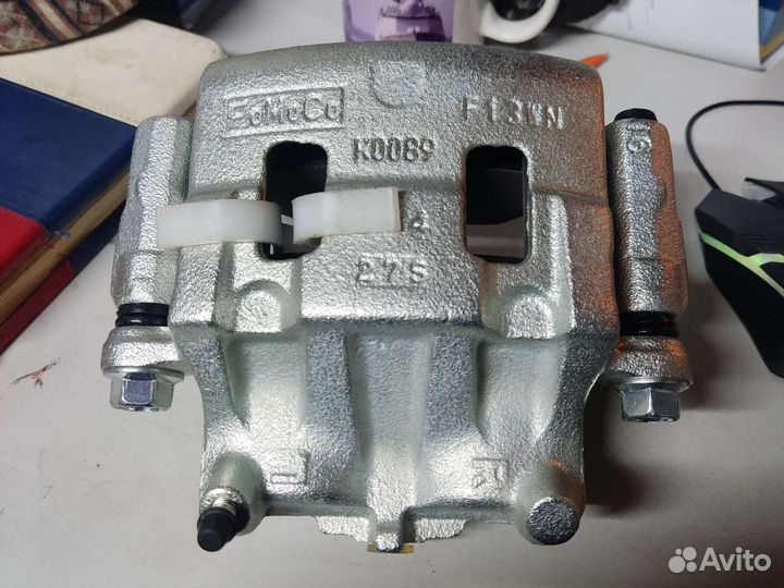 Суппорт левый mazda L20633990B