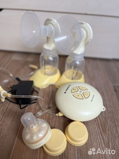 Молокоотсос medela электрический