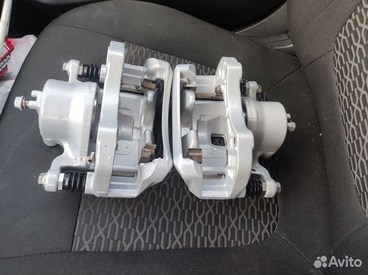 Суппорта передние Nissan tiida