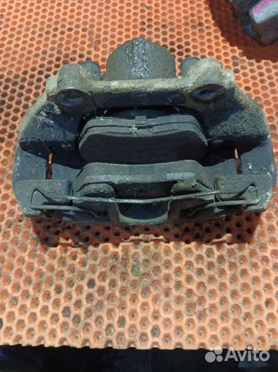 Суппорт тормозной передний левый Volkswagen Polo