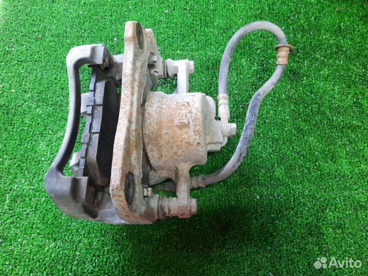 Суппорт тормозной передний левый Toyota Camry