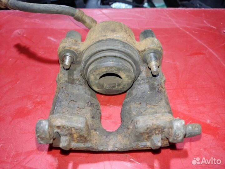 Суппорт тормозной передний левый Opel Astra G