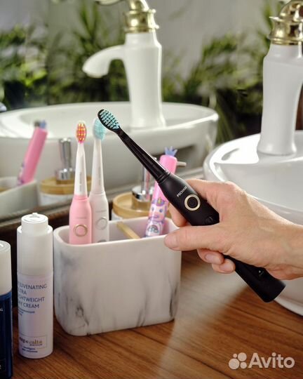 Электрическая зубная щетка