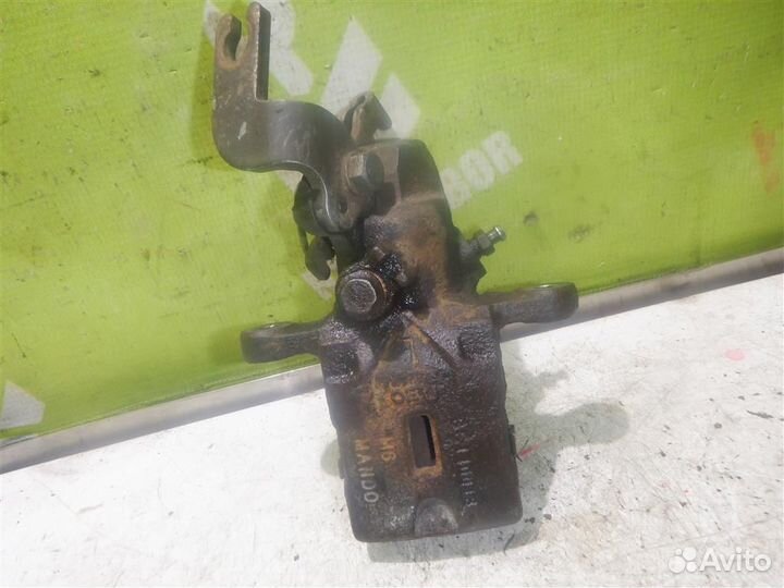 Суппорт задний левый Хендай Лантра 96-00