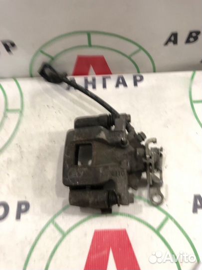 Суппорт тормозной задний левый Mitsubishi