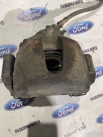 Суппорт тормозной передний левый Ford Focus 2