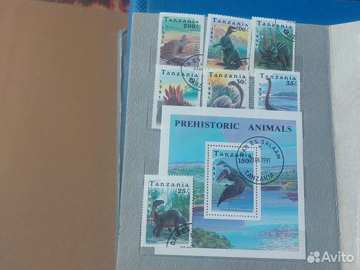 Альбом с почтовыми марками динозавры.Африка.Азия